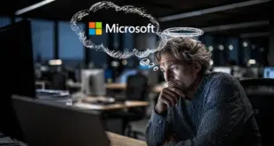 Un employé de bureau est assis devant son ordinateur, avec un regard un peu mystérieux ou complice