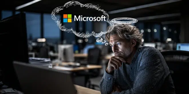 Un employé de bureau est assis devant son ordinateur, avec un regard un peu mystérieux ou complice