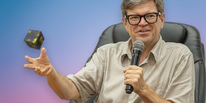 Yann LeCun et une cube flottant dans sa main