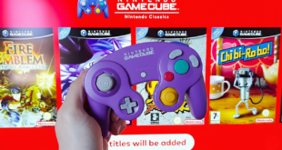 Une main tenant une manette violette devant le catalogue GameCube