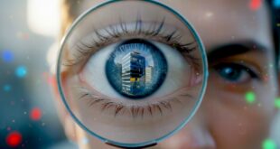 grosse loupe zoomant sur un œil avec le reflet d'un immeuble pour illustrer la visibilité d'entreprise promise par l'AEO et le GEO