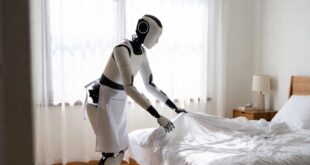 Un robot humanoïde majordome en train de ranger le lit