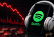 Spotify sur un smartphone avec une casque. Graphe de chute rouge