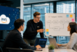 Réunion d'une équipe avec des ingénieurs AWS dans un bureau moderne pour déployer des solutions d'IA chez un client.